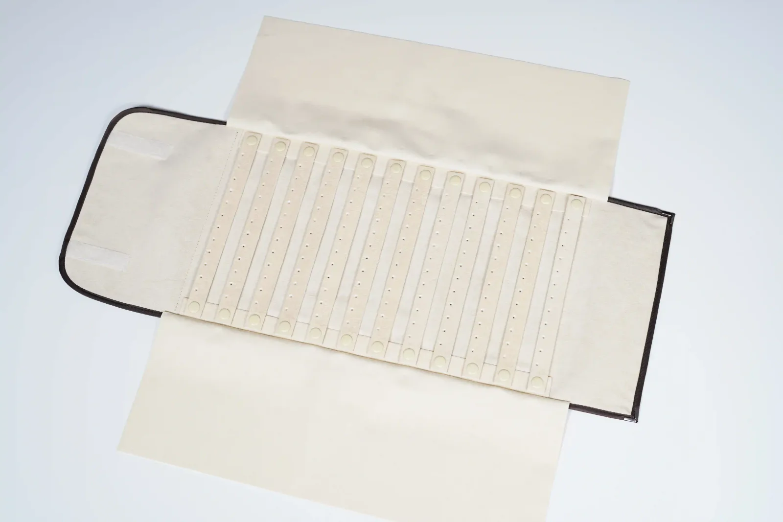 Snap-button earring storage roll